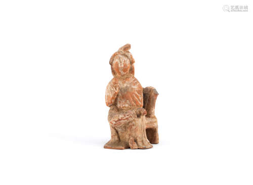Tang dynasty A small pottery figure of a court lady