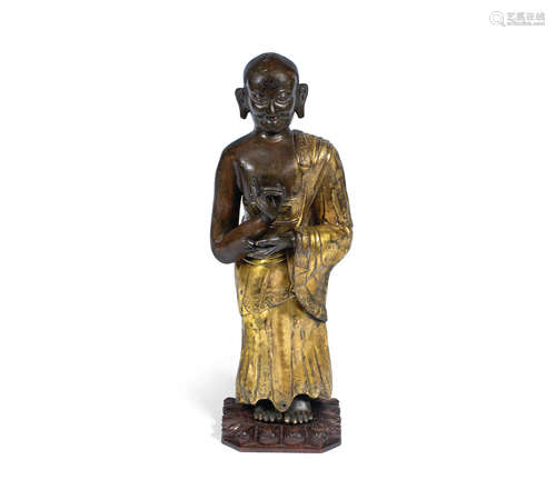 18th/19th century A gilt-bronze repoussé figure of a Buddhist monk