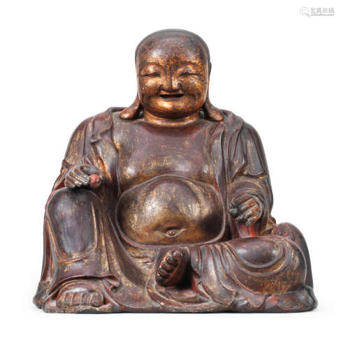 Ming Dynasty  A rare and large parcel-gilt-lacquered wood figure of Budai