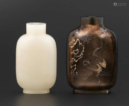 19th century A white jade snuff bottle and a smoky quartz snuff bottle