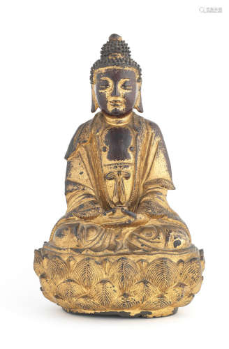 16th/17th century A gilt-lacquered bronze figure of Buddha