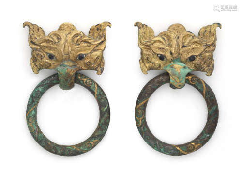 Eastern Zhou Dynasty A rare pair of gilt-bronze inlaid 'taotie mask' ring handles