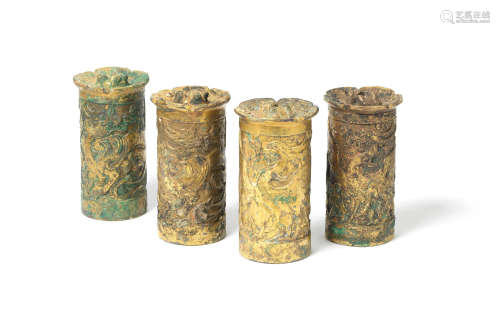 Han Dynasty A very rare set of four archaic gilt-bronze axle caps