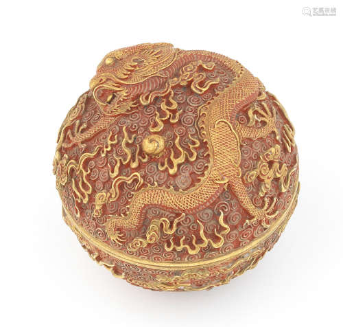 Daoguang seal mark and of the period A very rare coral-ground and gilt 'dragon' seal paste box and cover