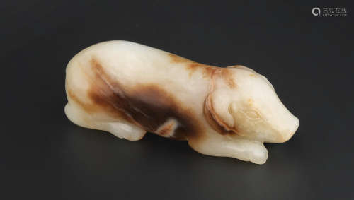 Song/Ming Dynasty A pale green and russet jade carving of a pig