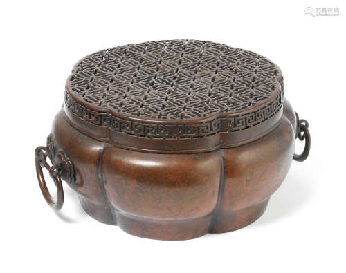 Zhang Mingqi zhi seal mark, 17th/18th century A bronze lobed hand warmer and cover