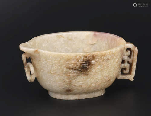 17th/18th century An archaistic 'chicken-bone' jade pouring vessel, yi