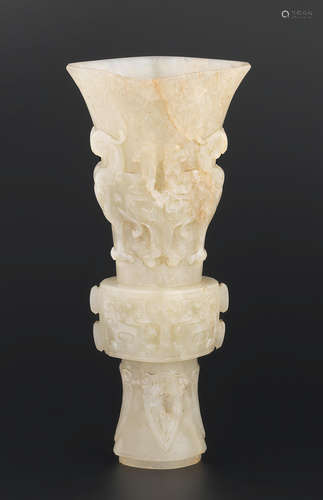 18th century An archaistic pale green jade 'phoenix' beaker vase, gu