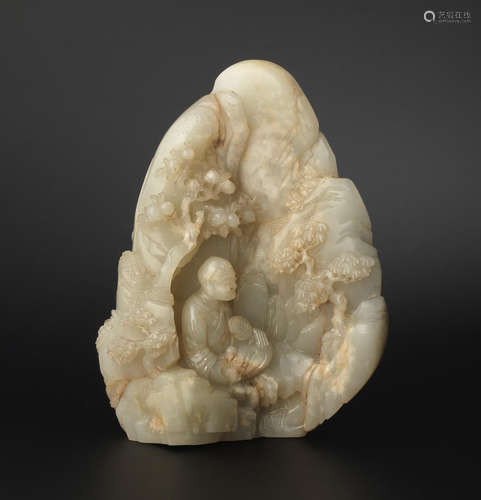 18th century A fine pale green jade carving of a luohan in a grotto