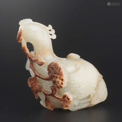 18th century A pale green and russet jade carving of a phoenix