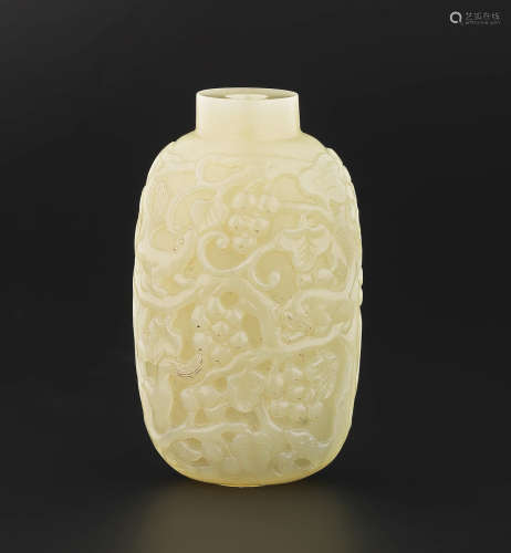 Qing Dynasty A fine yellow jade 'squirrel and grapes' snuff bottle