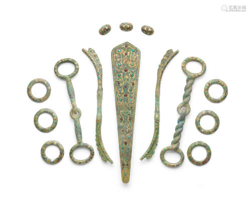 Eastern Zhou Dynasty A rare set of gold, silver and hardstone-inlaid bronze harness fittings