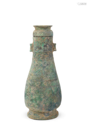Zhou Dynasty A rare archaic bronze 'phoenix' ritual wine vessel and cover, hu