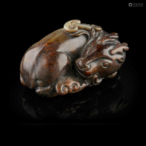 ARCHAISTIC GREEN AND RUSSET JADE CARVING OF A DEER