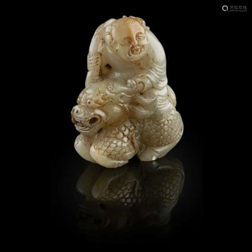 JADE CARVING OF THE LOTUS BOY ON A QILIN