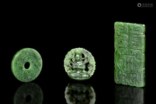 A GROUP OF THREE SPINACH JADE CARVED PENDANTS