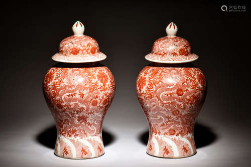 PAIR OF UNDERGLAZED RED 'DRAGONS' COVERED JARS