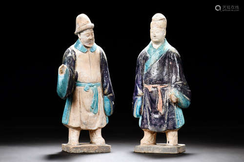 TWO CLAY AND PAINTED 'PERSON' FIGURES