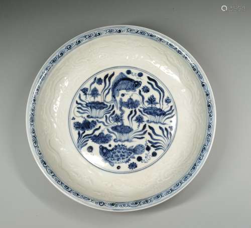 A Blue And White Carved Dragon Dish