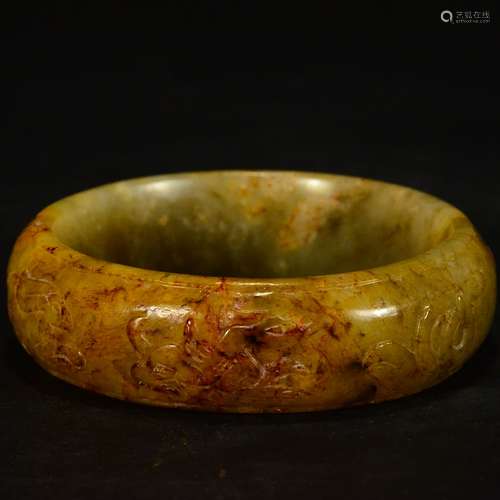 A Carved Yellow Jade Bangle