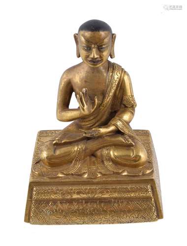 A Sino-Tibetan gilt-bronze seated figure of an Arhat , Qing Dynasty