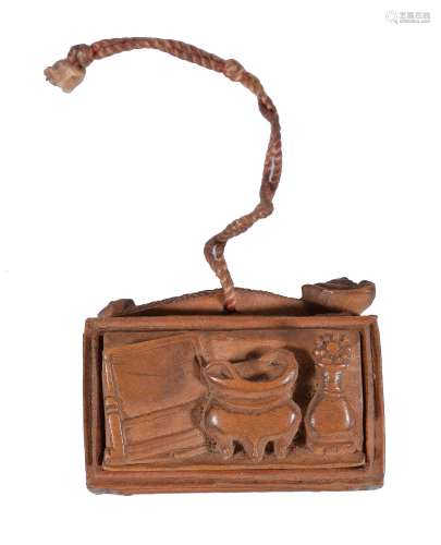A Chinese carved bamboo pendant, the exterior carved with an abacus