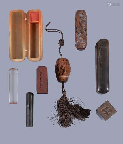 Two Chinese hardwood seals , 4cm and 4.5cm high; a glass seal , 6cm high