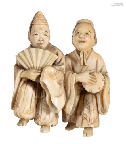 Ω A Japanese Ivory Netsuke, in the form of two standing figures