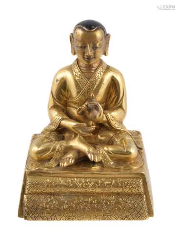 A Sino-Tibetan gilt-bronze seated figure of an Arhat , Qing Dynasty