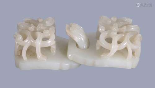 A Chinese white jade 'chilong' two-part belt buckle, Qing Dynasty