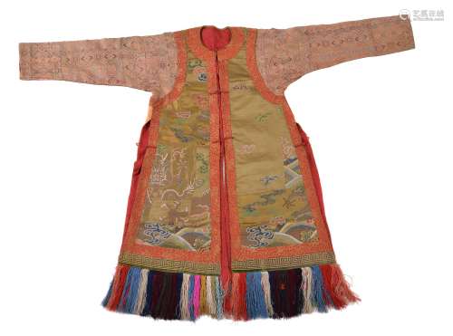 A 19th century Tibetan lamas coat, worn on festive occasions with many...