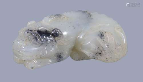 A Chinese white and black jade mythical lion