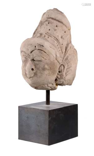 An Indian stucco head of a Diety, Tangjore, South Indian, circa 17th century