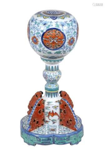 A rare Chinese Doucai hat stand, modelled in two sections and with a cover
