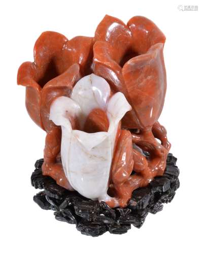 A Carnelian agate triple flower vase, the stone in varying white and coral...