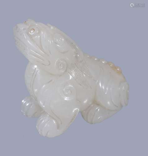 A Chinese white jade Buhhistic lion, seated with head raised up