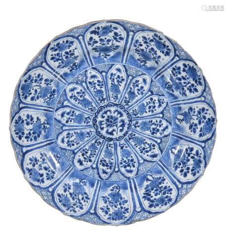 A Chinese blue and white charger, Kangxi, painted with a radiating floral...