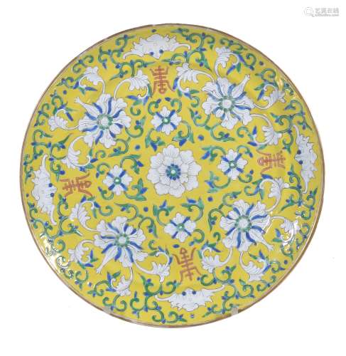 a Chinese yellow ground plate , 19th century, painted with flowers