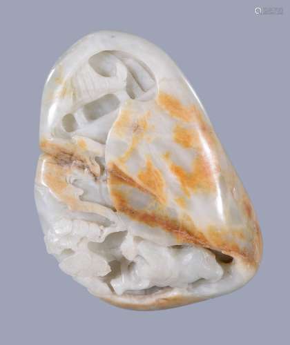 A Chinese small white jade and russet boulder carving