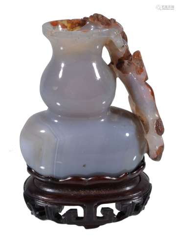 A small Chinese grey and russet carved agate double-gourd vase, Qing Dynasty