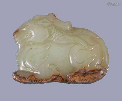 A Chinese yellow and russet jade goat pendant