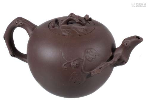 A Chinese Yixing teapot and cover, the branch-form handle and spout moulded...