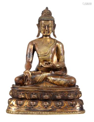 A gilt-bronze figure of Ratnasambhava , Tibet, 15-16th century