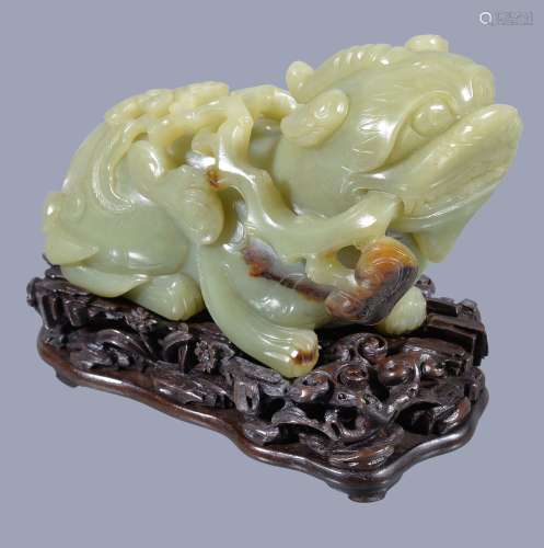 A large Chinese yellow jade model of a Qylin or mythical Lion