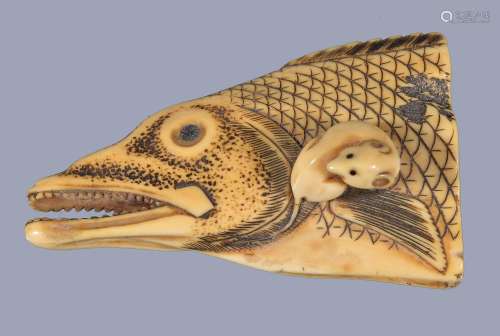 Ω An Ivory Netsuke depicting a rat seated on top of a severed salmon head