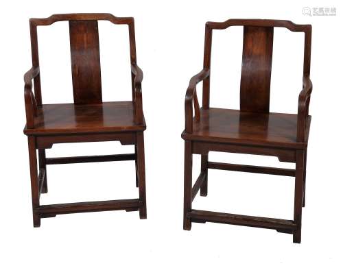 A pair of Chinese hardwood yokeback chairs, of rectangular form