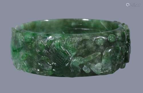 A Chinese nephrite jade bangle, the exterior carved with cranes