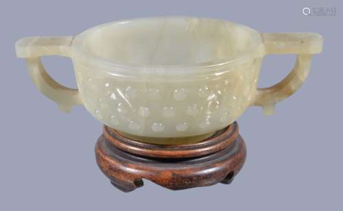 A Chinese small celadon jade two-handled bowl, Qing Dynasty