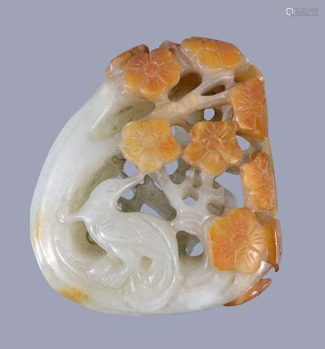 A Chinese pale celadon and russet jade 'magpie and prunus' pendant