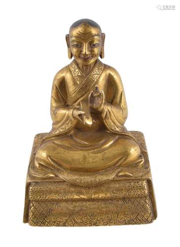 A Sino-Tibetan gilt-bronze seated figure of an Arhat , Qing Dynasty